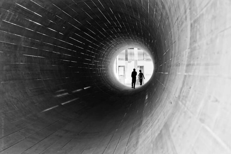 visitors in the middle of Monument for People on the Move by Hans Schabus