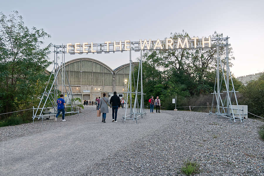 visitors passing under Nathan Coley's work at Grandes Locos, Lyon - France