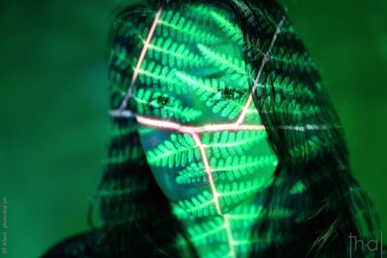 Female portrait with video projection of ferns