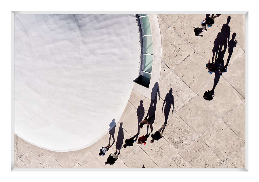 giant shadows of visitors on the forecourt of the PCF headquarters in Paris