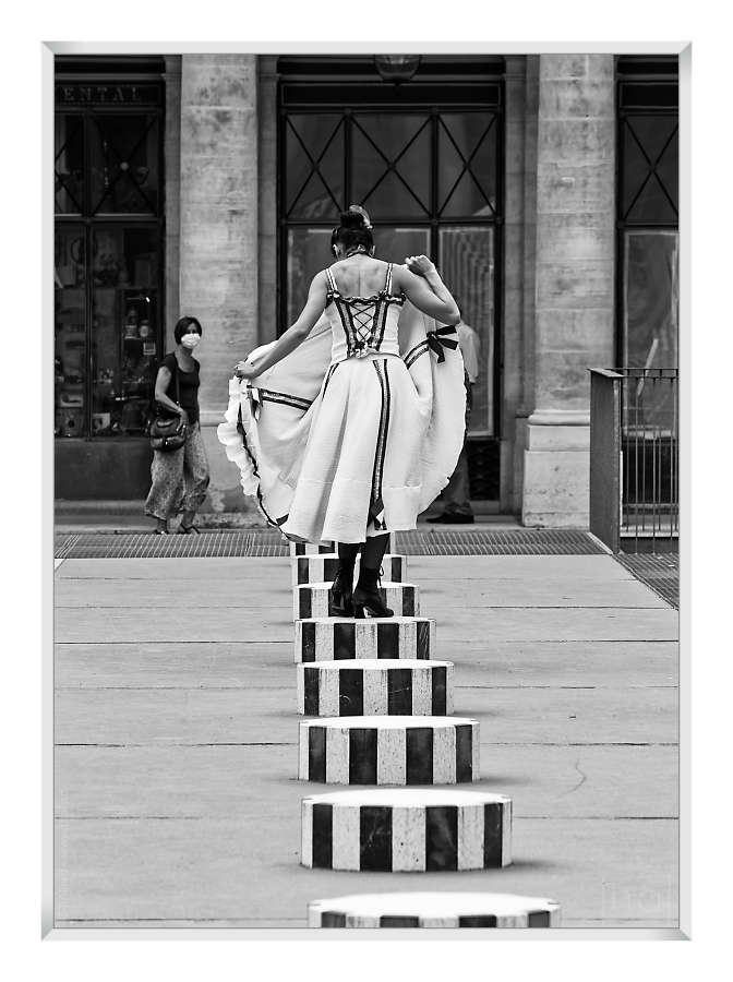 French cancan dancer on a column of the Palais Royal in Paris