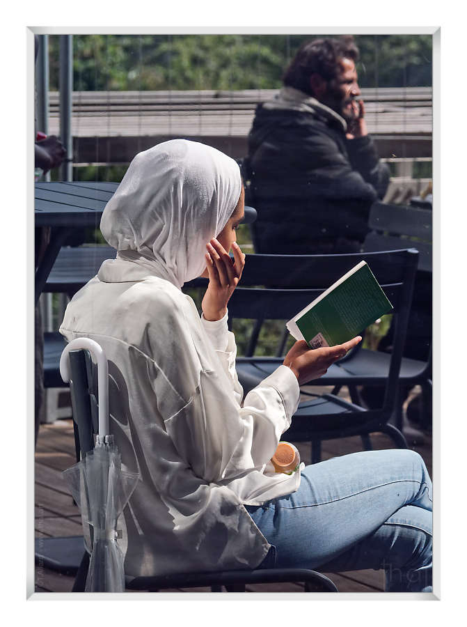 Veiled reader on the terrace of the BNF in Paris