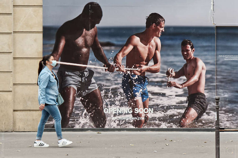 Street photo of a woman with a mask linked to a photo of a rope on a store poster