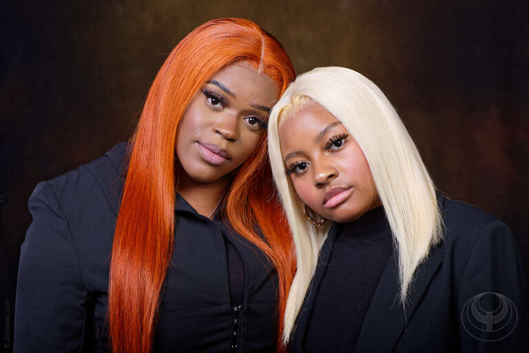 Portrait of 2 models with fashion accessory wigs