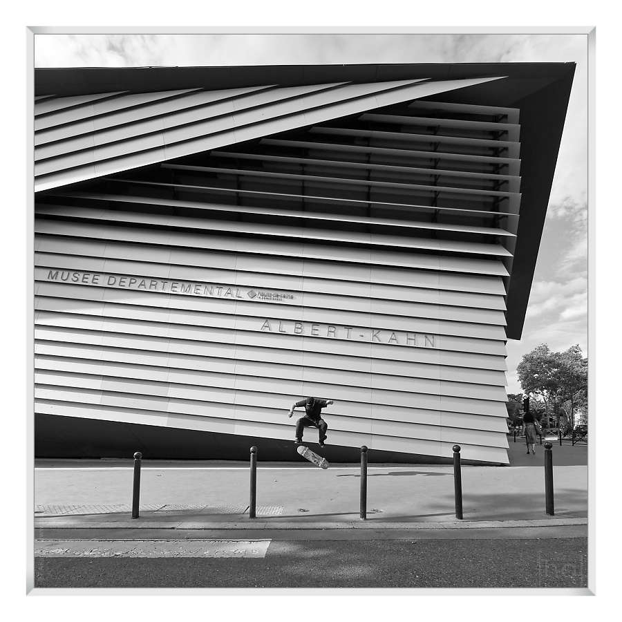 skateboarder performing a jump in front of the Albert-Kahn museum in Paris